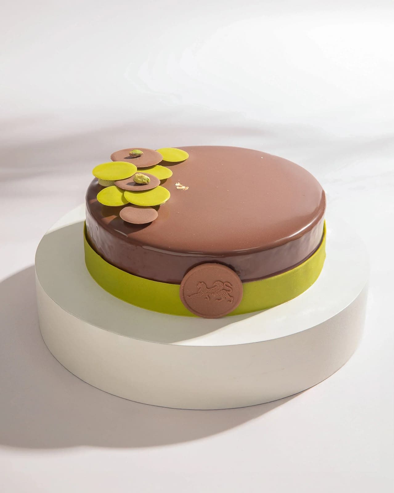 Chocolate Pistachio Cake on a white stand
