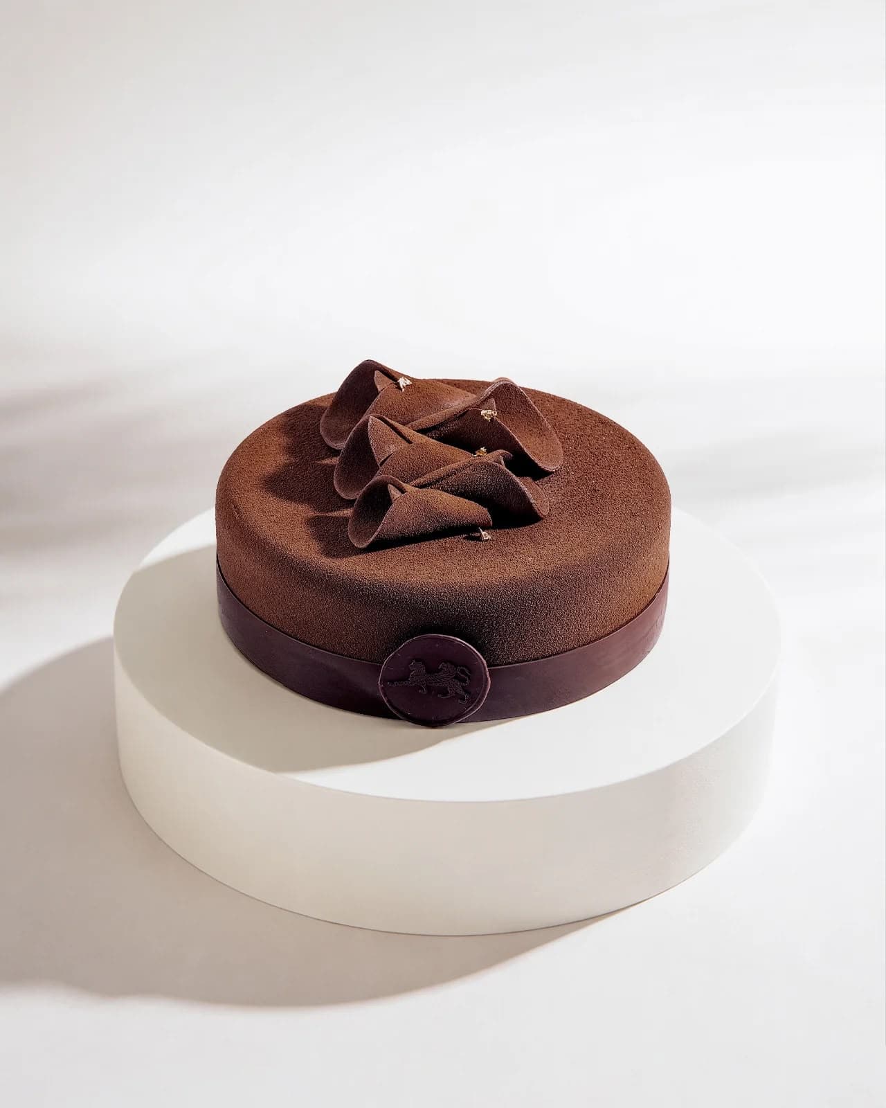 Sugar-Free Truffle Cake on a white stand